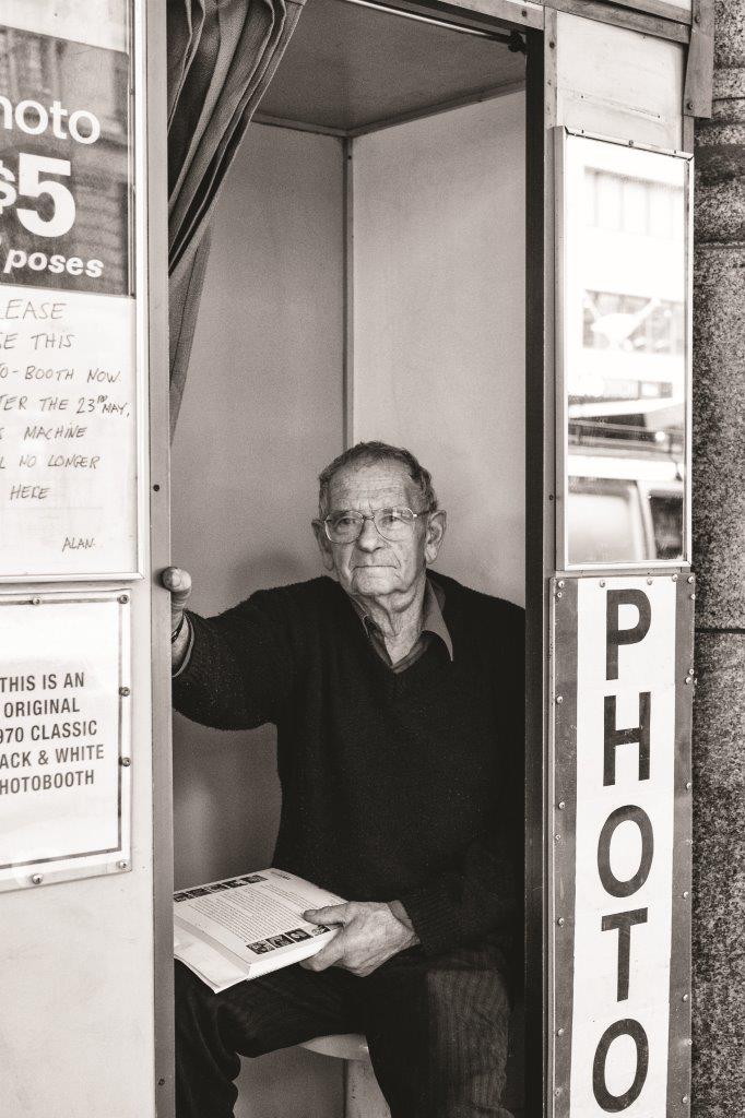 photo of alan adler in a photo booth at flinders street station